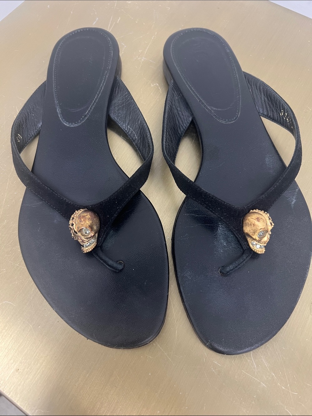 Alexander McQueen Black Thong Sandals with Gold Skull Embellishments